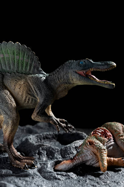 istock spinosaurus with a stegosaurus body on a ground with craters vertical composition 1289103256