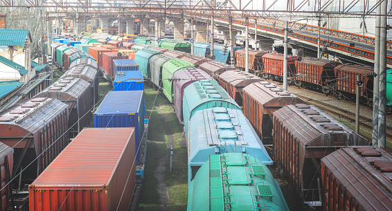 Railway wagons with cargo of metal and grain in port of Odessa. trains are waiting in line for loading at cargo terminal. most economical logistics solutions for rail transport
