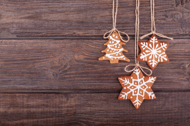 Christmas gingerbread cookies on wood rustic background. The cookies are homemade made by me and are unique and can not be found anywhere.