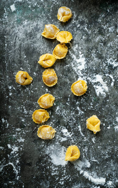 Raw Uncooked Cappelletti with flour stock photo