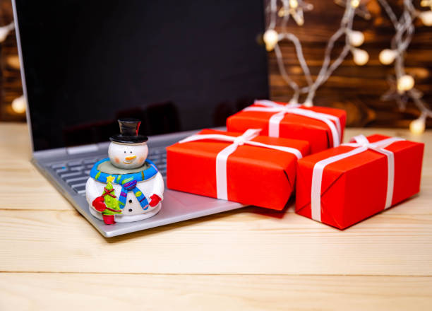 istock Winter holidays sales. Using credit card to internet shop 1289120347
