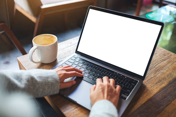 istock a woman using and typing on laptop computer keyboard with blank white desktop screen 1289120522