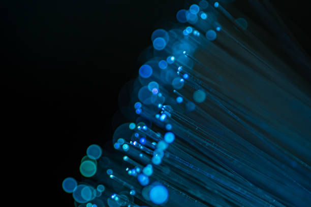 istock Close up of abstract background fiber optics,internet communication concept 1289121433