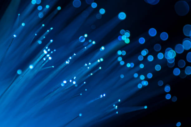 istock Close up of abstract background fiber optics,internet communication concept 1289121436