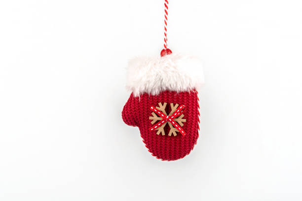 istock Knitted mitten with fluffy fur. Christmas decoration on a white background. 1289122267