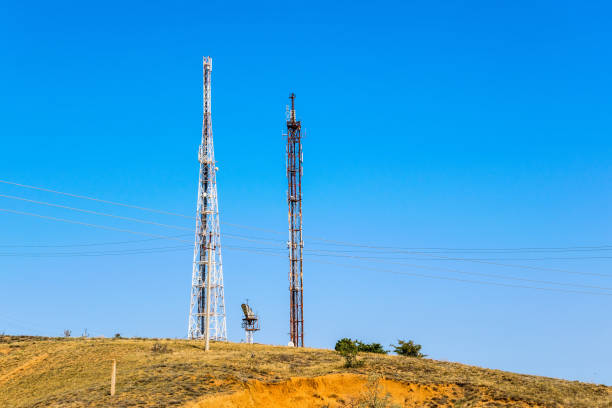 istock Telecommunication towers against blue sky 1289125782