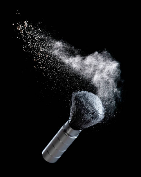 white powder splash and cosmetic brush for makeup on black background - face powder exploding make up dust imagens e fotografias de stock