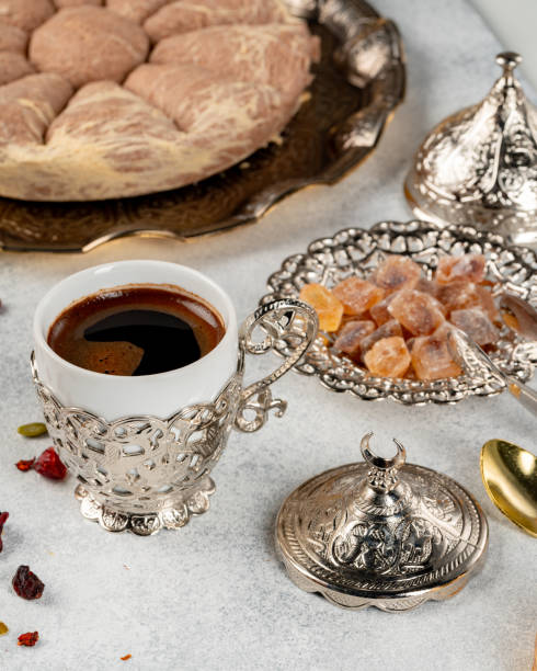 istock Cup of coffee and turkish pastries on dark surface 1289126843