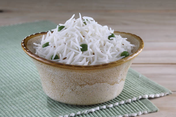 Basmati rice in a bowl. Famous for the aroma and taste cooked Indian basmati rice in bowl basmati rice stock pictures, royalty-free photos & images