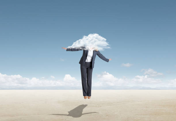 istock Woman Floating On Air With Head In The Clouds 1289131457