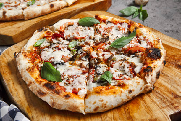 istock Pizza with mushroom and tomato 1289133015
