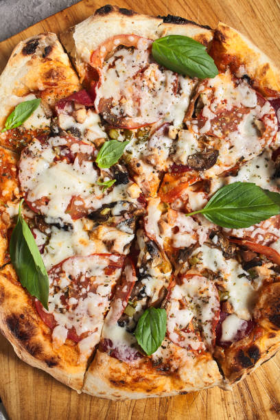 istock Pizza with mushroom and tomato 1289133017