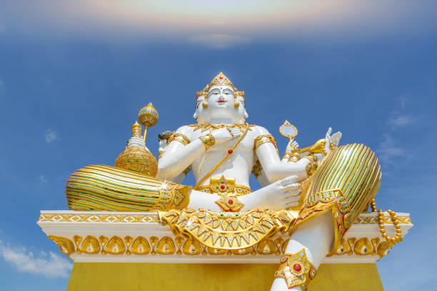 istock Brahma statue Hindu creation god with beautiful sky 1289134161