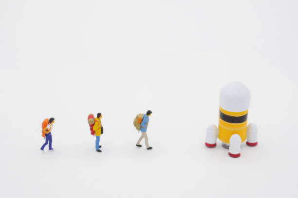 istock Travelers lining up to go on a space trip with a rocket 1289135253