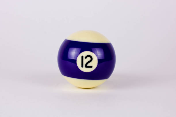 Shiny dark blue white ball number 12 for billiard isolated on white background. High quality photo