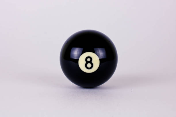 istock Shiny black ball number 8 for billiard isolated on white background 1289137087