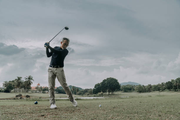 istock asian chinese mature man golfer is preparing to teeing off at golf course 1289137089