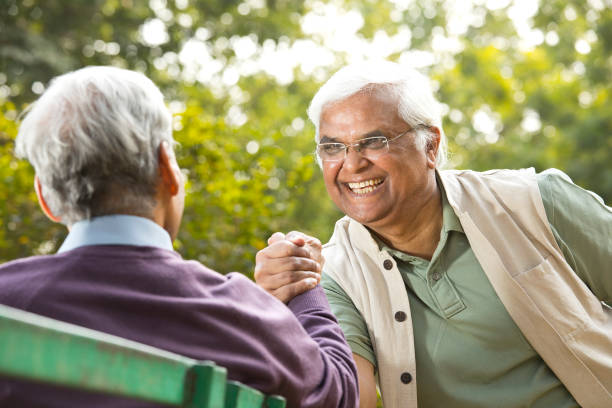 istock Two retired elderly men arm wrestling outdoor 1289138234