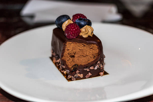 istock A slice of delicious cake on a white plate. 1289138239