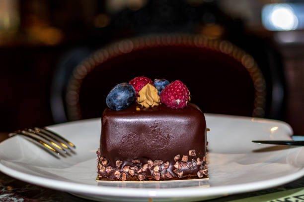istock A slice of delicious cake on a white plate. 1289138241