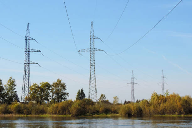 istock High Power Transmission Lines and summer landscape , river and meadow 1289140045