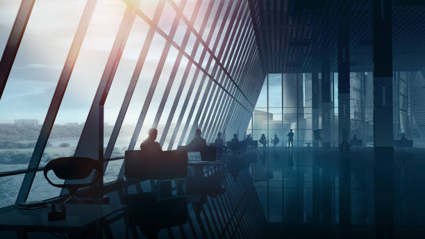 istock Modern spacious office interior with silhouettes of people. 1289140902