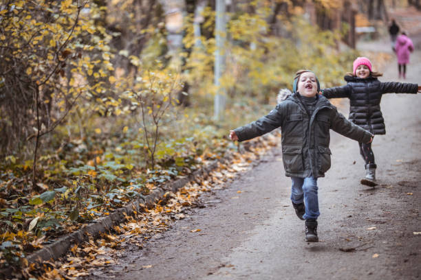istock Kids have fun running in nature 1289141802