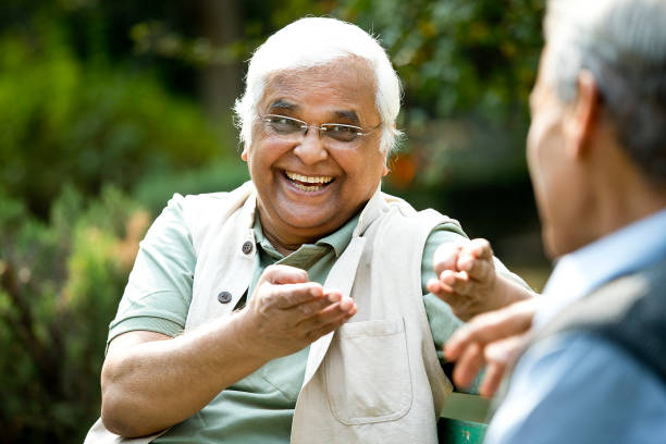 istock Two senior men discussing on park bench 1289142953