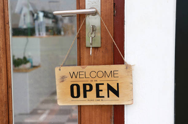 istock Open sign hung on the door. 1289143182