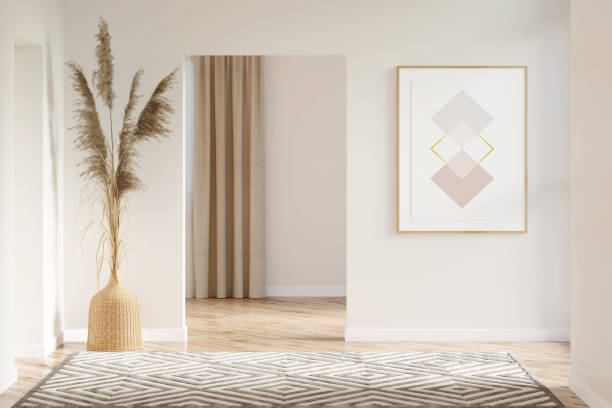 interior of a beige hall with a vertical poster, pampas grass in a wicker vase between doorways, a carpet on a parquet floor, overlooking a room with a window. - door curtain imagens e fotografias de stock