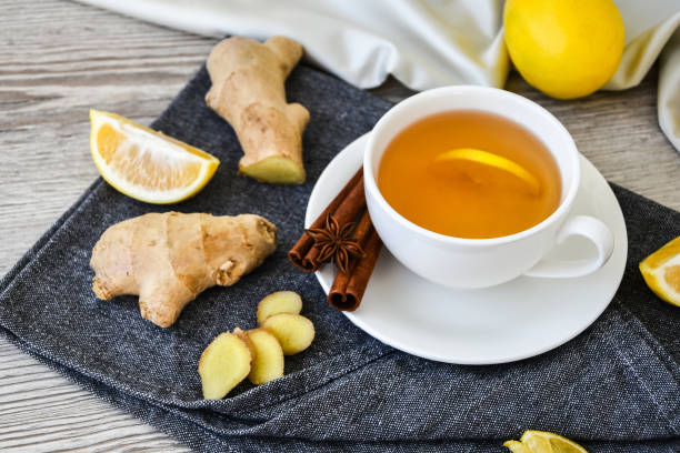 istock Ginger hot immunity boosting Vitamin natural drink With citrus lemon cinnamon anise in a rustic style on wooden background. Chamomile tea 1289144863