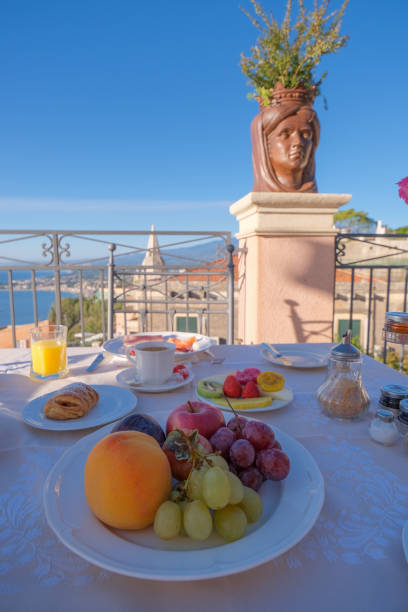 istock Taormina Sicily Italy breakfast table with a rooftop view over Taormina 1289144967