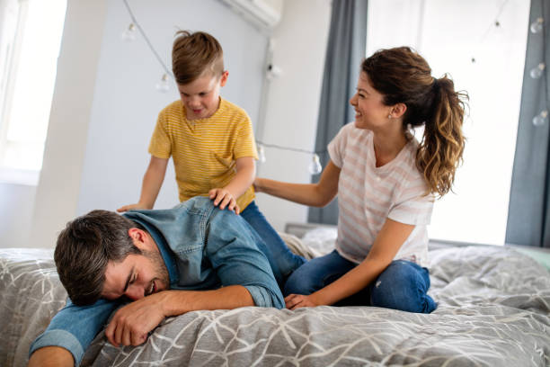 istock Happy family having fun time at home 1289145723