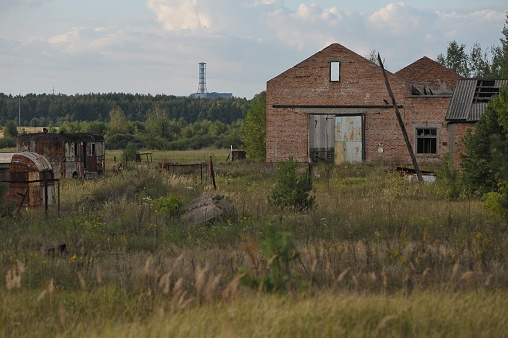 Abandoned farm and radioactive graveyard near village Kopachi, post apocalyptic view of nuclear power plant, Chernobyl exclusion zone, Ukraine