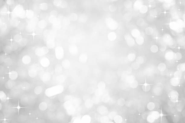 abstract blur beautiful glowing white color background with circle bokeh light and shining star glittering for christmas festival and happy new year season design as banner concept