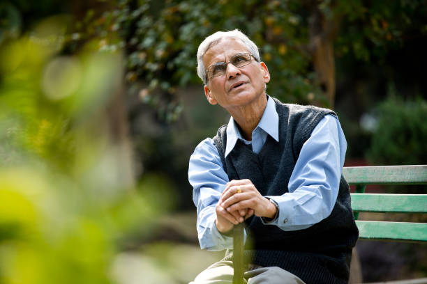 istock Thoughtful senior man at park 1289147240