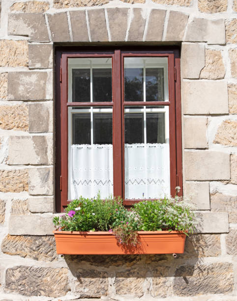 istock Window from outside with flowers, old building 1289148319