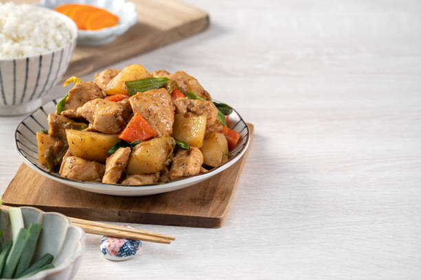 istock Homemade delicious cubed chicken with braised potato chunks. 1289148488