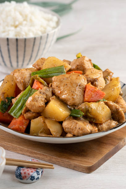 istock Homemade delicious cubed chicken with braised potato chunks. 1289148489