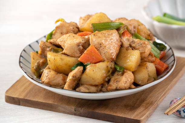 istock Homemade delicious cubed chicken with braised potato chunks. 1289148500