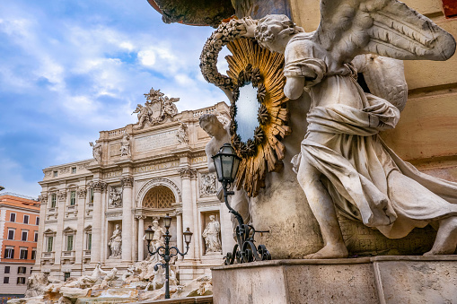 The splendid scenery of the Trevi Fountain without people. Built in 1732 on the wishes of Pope Clement XII, the Trevi Fountain it's one of the symbols of the late Roman Baroque, recognized as one of the most beautiful and famous fountains in the world. This fountain is also famous for being the setting for the film \
