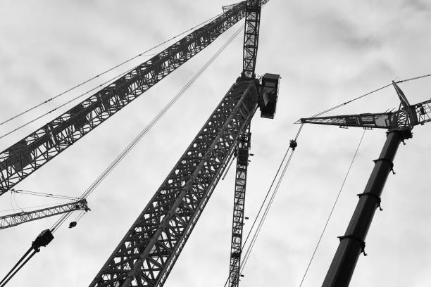 istock Telescopic cranes under a white sky. Construction industry 1289149981