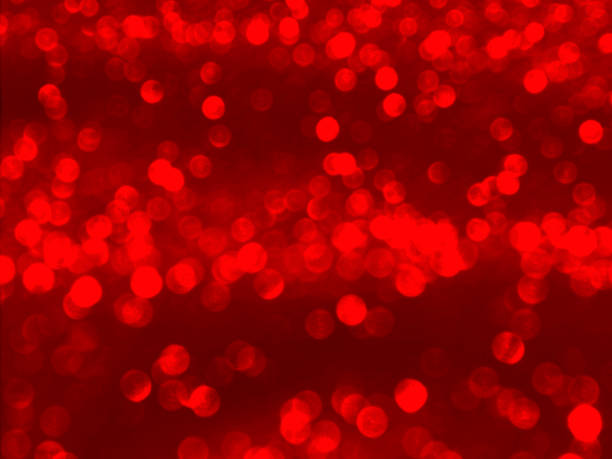 istock Shiny festive red bokeh background 1289150360