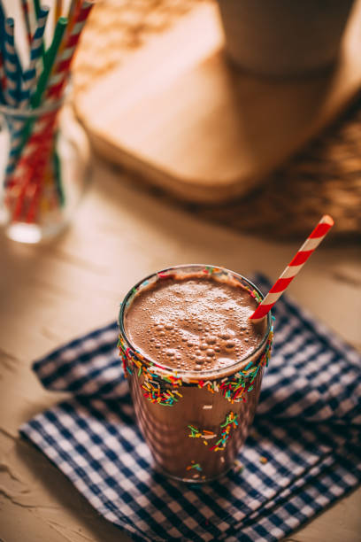 istock Chocolate Milkshake With Paper Straws on Rustic Table 1289151389