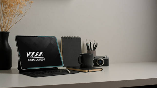 istock Home office desk with tablet, stationery, camera and decorations 1289153637