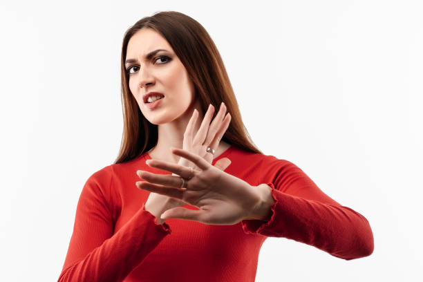 istock Image of dissatisfied girl doing disgust face because aversion reaction with hands raised. Facial expression concept 1289155547