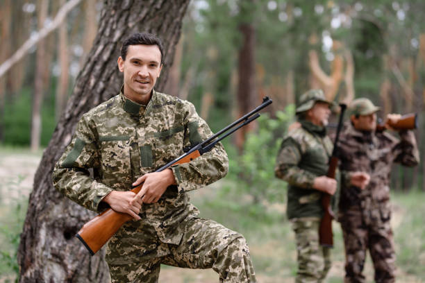 istock Happy Shooter with Rifle Rabbit Hunt in Summer. 1289156565