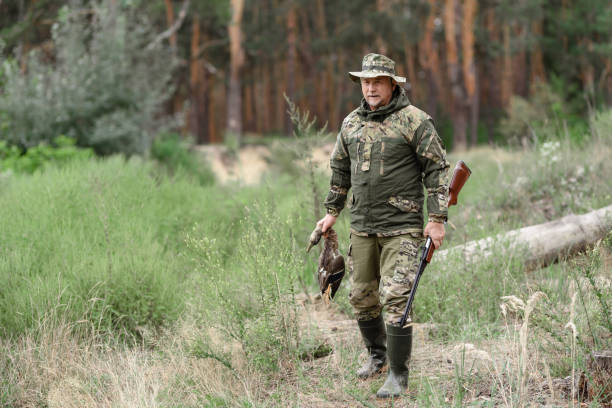 istock Happy Old Hunter Holds Wildfowl Wild Duck Hunt. 1289156615