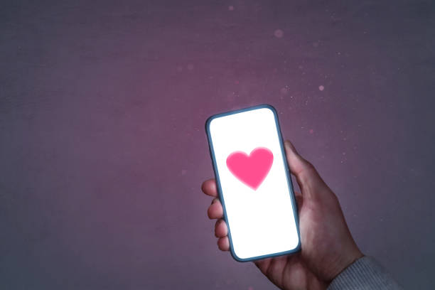 istock Smartphone screen with a heart symbol 1289157045