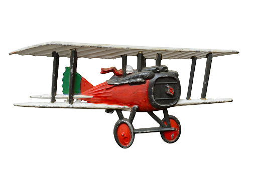 Antique embossed relief decoration, generic Great War (First World War) red toy airplane, isolated on white background